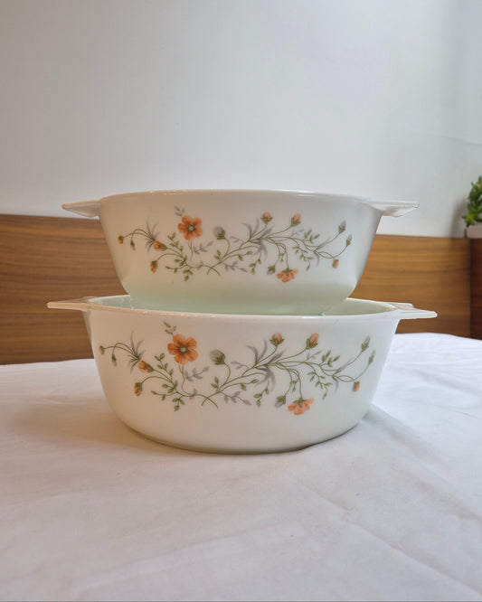 Two ceramic bowls with floral patterns on a white background