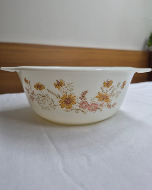 Floral-patterned ceramic bowl on a white surface