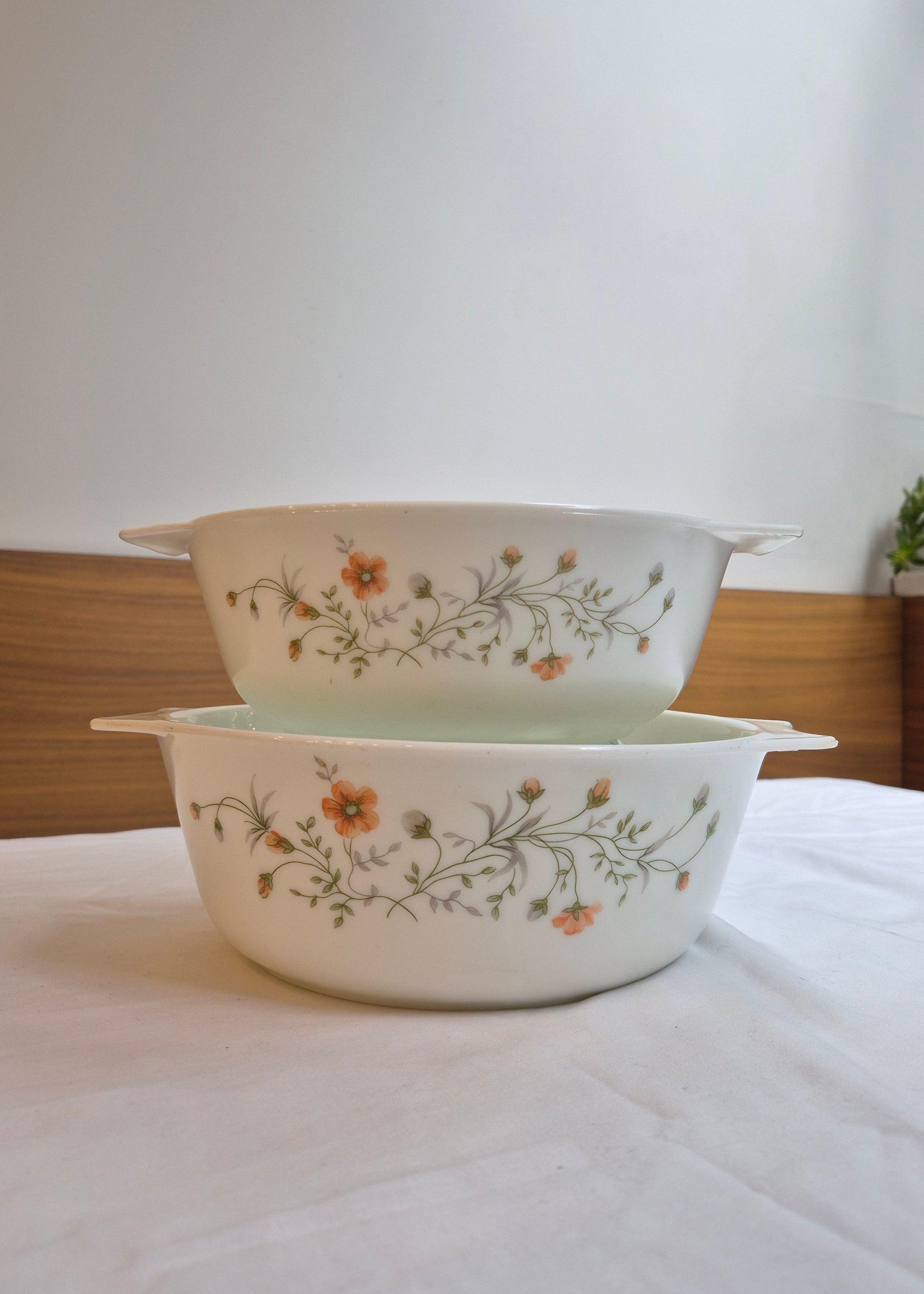 Two ceramic bowls with floral patterns on a white background